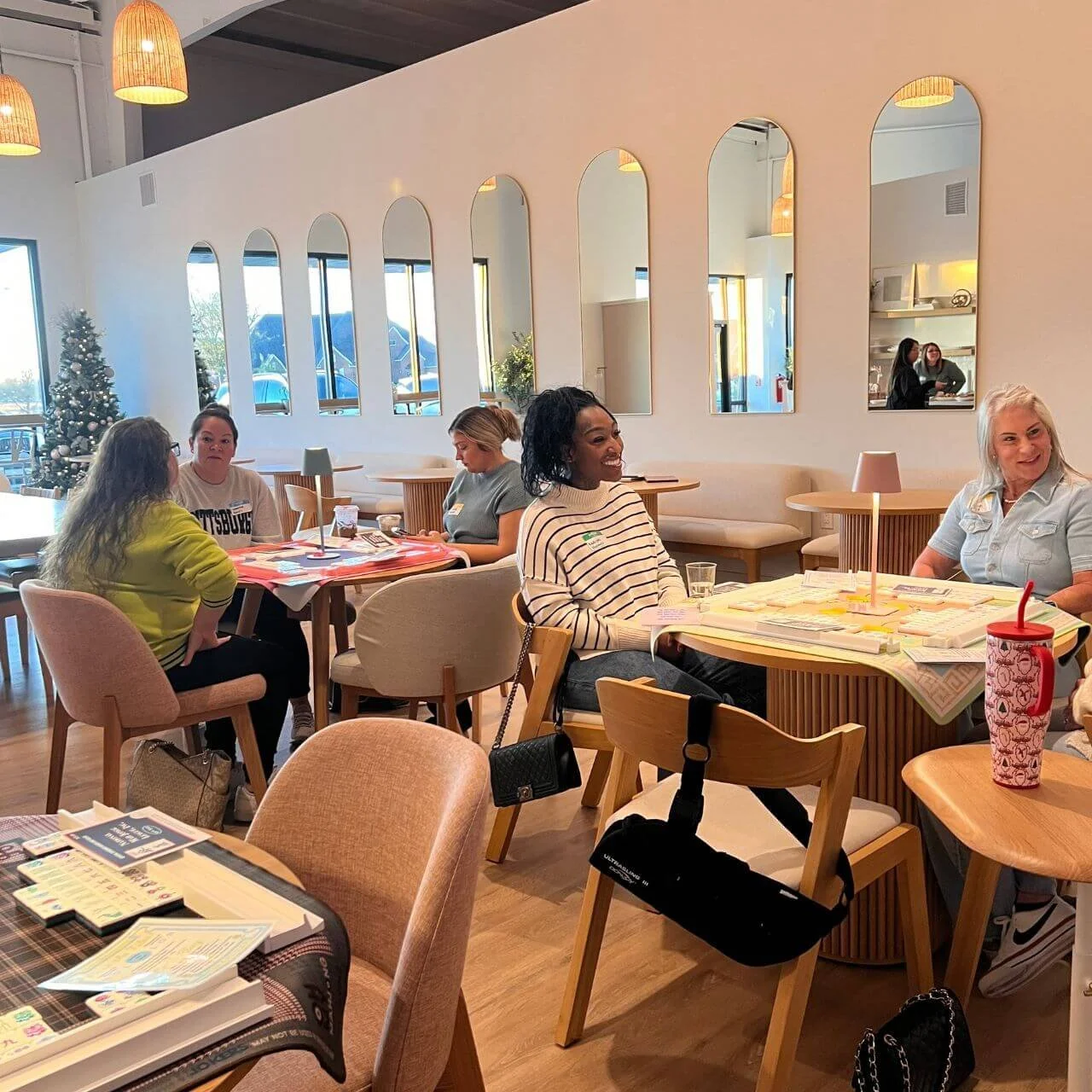 Large group of women at Her Facility Coworking to learn the game of American Mahjong - Mahjong 101 Lesson