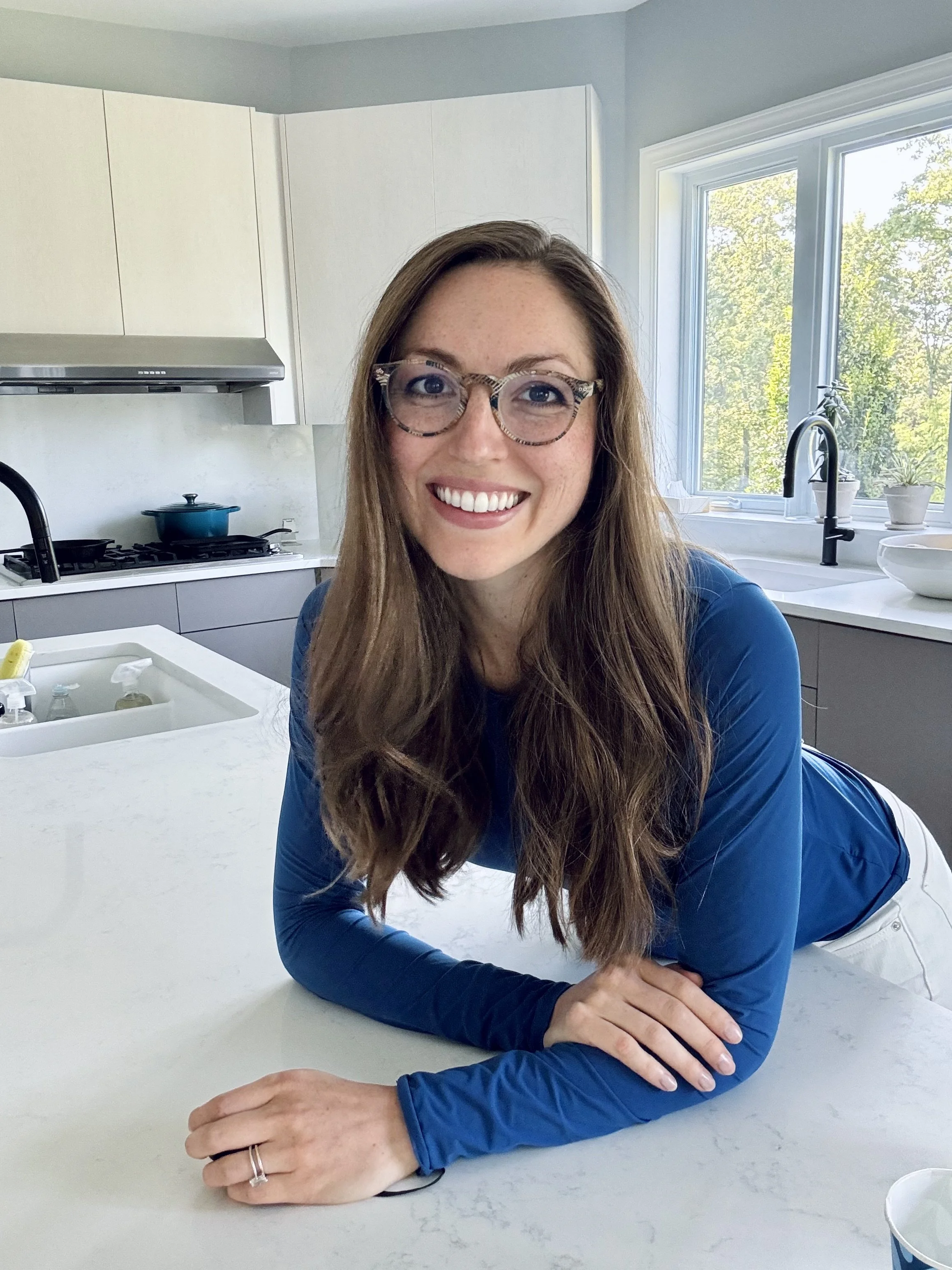 Woman in Lewisburg, Union County, PA, in a clean kitchen, who founded a residential cleaning services company that uses non-toxic non-chemical cleaning solutions.
