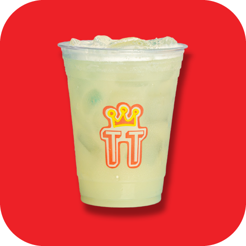 A plastic cup filled with a pale yellow-green beverage with ice, featuring a logo with a crown and stylized initials on a red background.