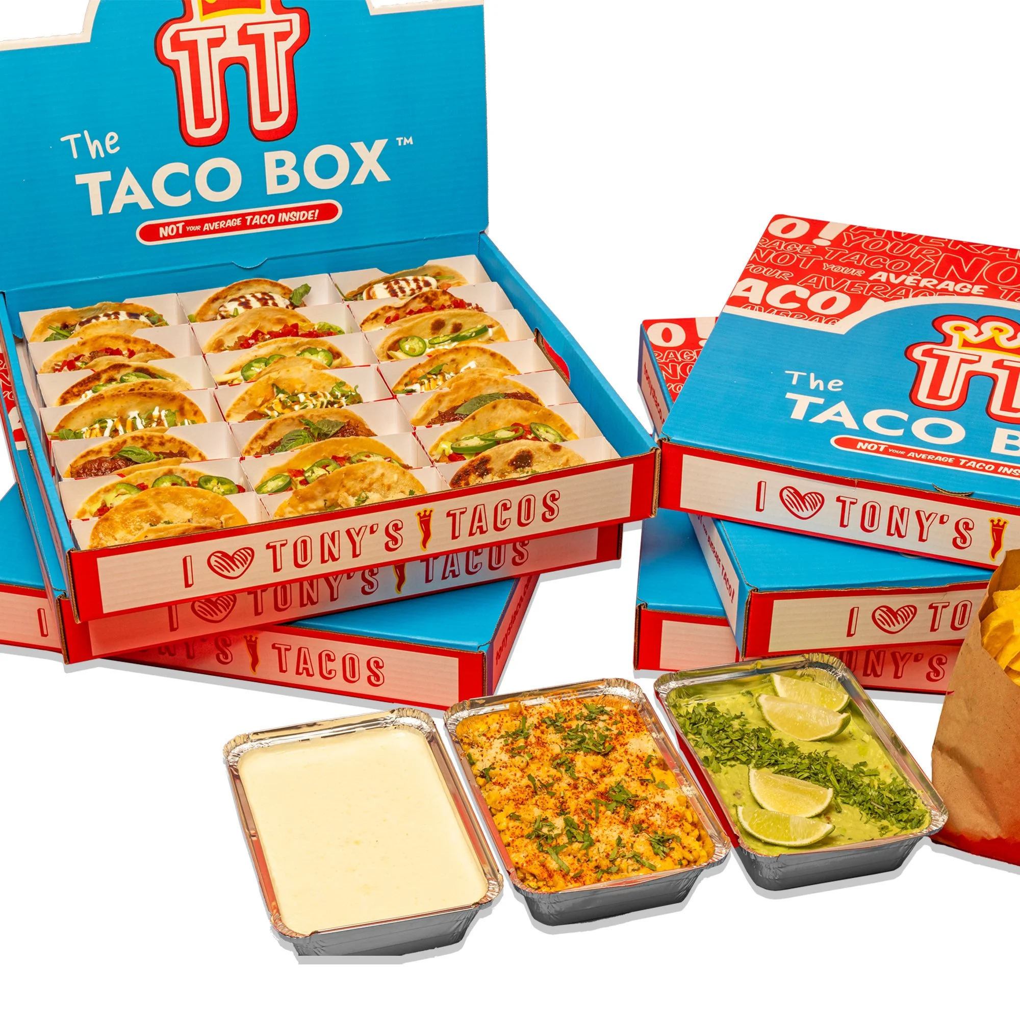 Multiple boxes of Tony's Tacos Taco Boxes with tacos inside, along with three small aluminum containers of sauces or toppings, including a white sauce, a rice dish, and a green sauce with lime wedges.