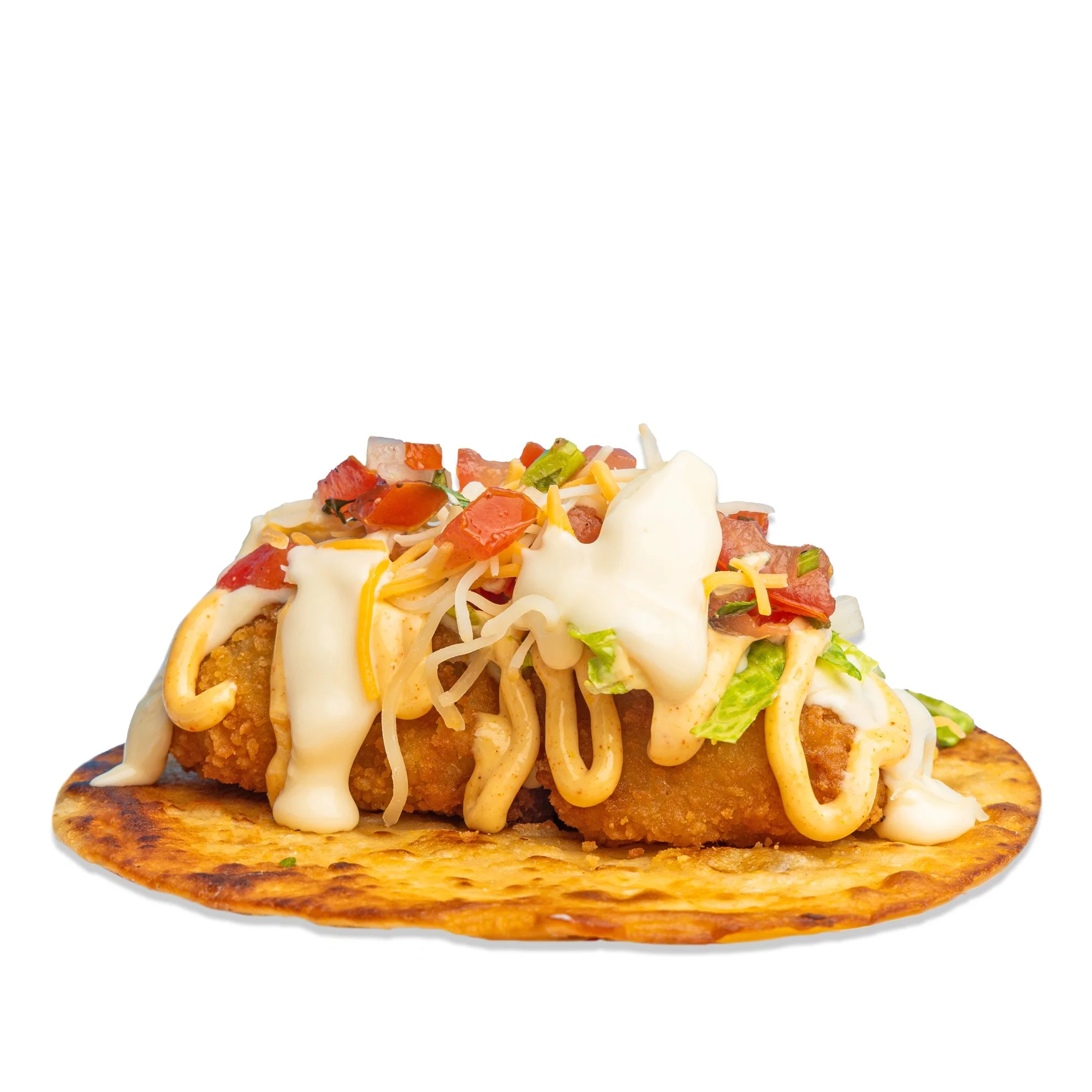 Fish taco with fried fish fillet, shredded cheese, lettuce, diced tomatoes, sour cream, on a crispy tortilla