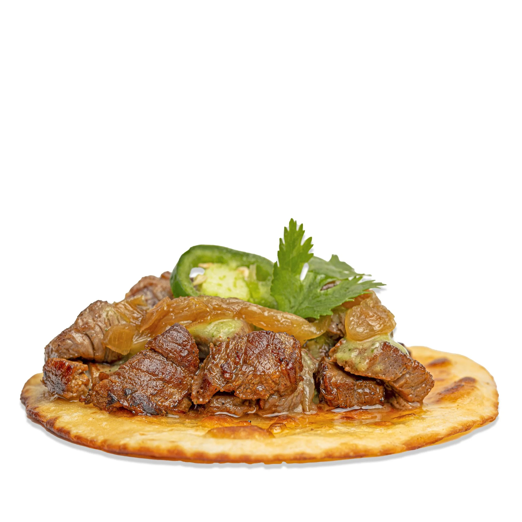 Taco with cooked beef, green jalapeño slices, cilantro, and shredded cheese on a crispy shell.