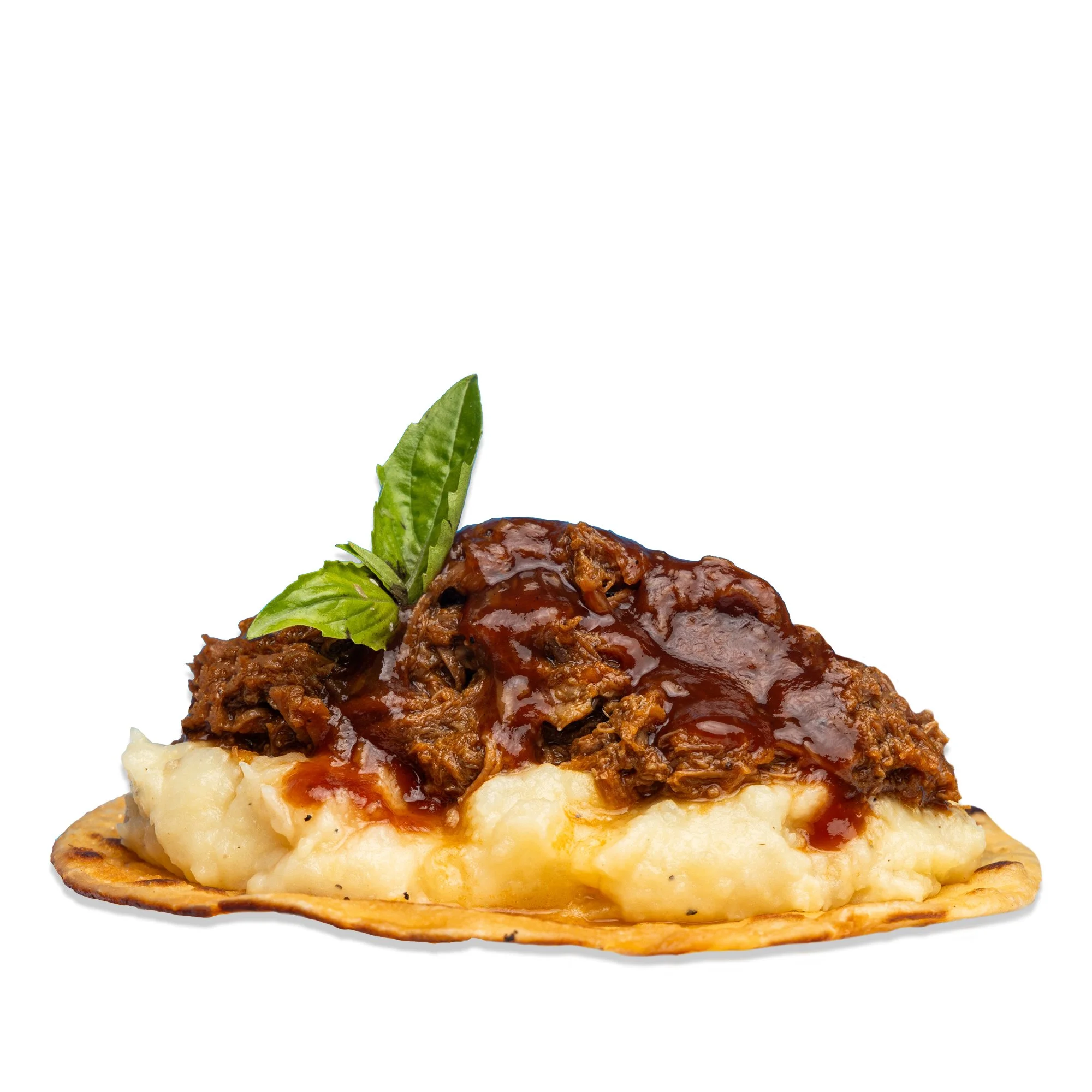SHORT-RIB PETER LUGER - Creamy mashed potatoes topped with tender short rib and drizzled with Peter Luger steak sauce.