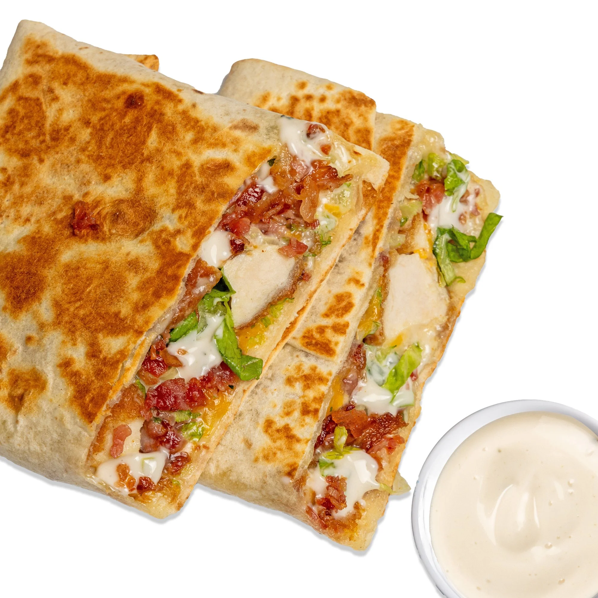 CHICKEN BACON RANCH QUESADILLA - Crispy chicken, ranch, bacon, lettuce, cheddar-jack, and chihuahua cheese folded into a warm tortilla.