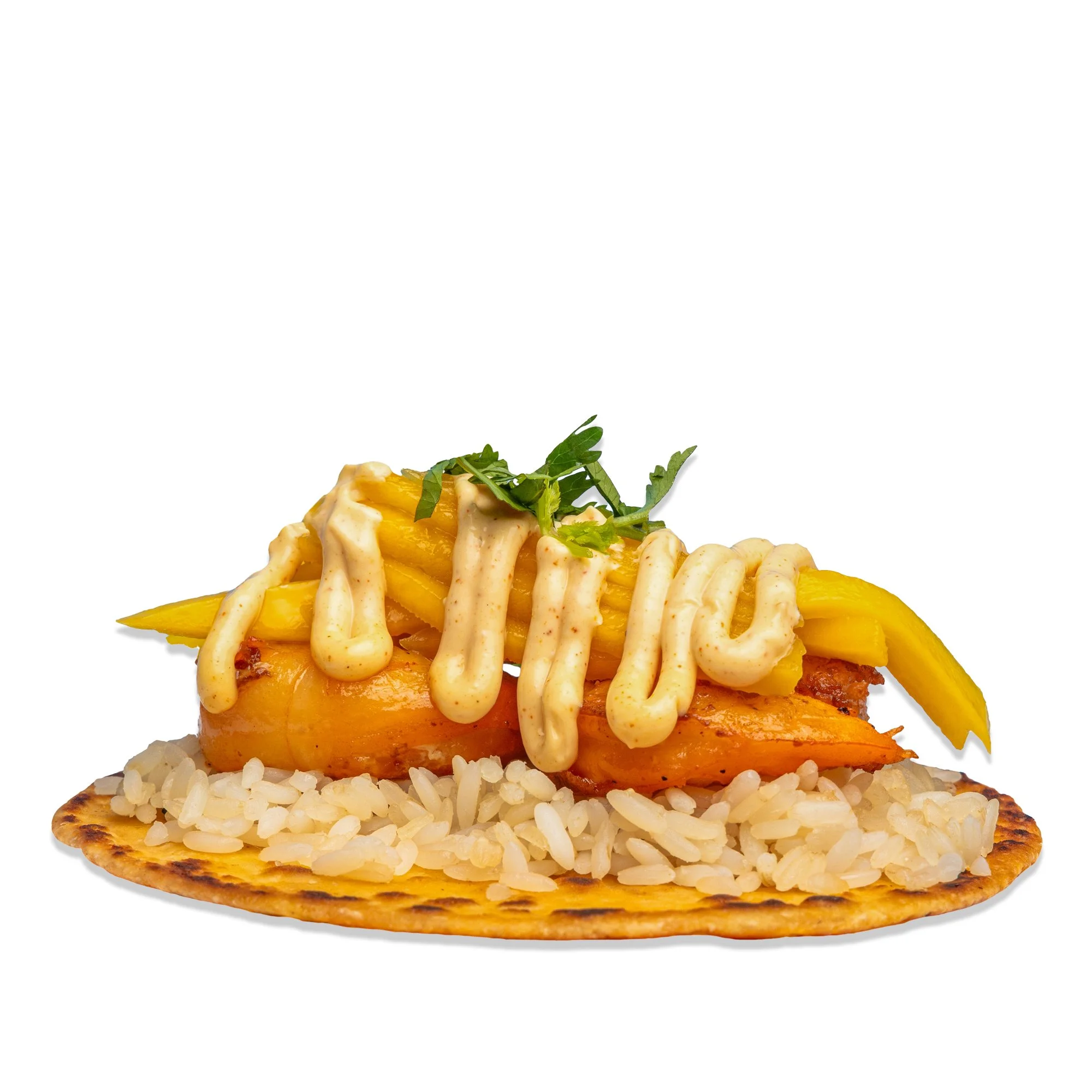 A taco with grilled fish, rice, yellow bell peppers, and sauce on a flatbread, garnished with herbs, on a plain white background.