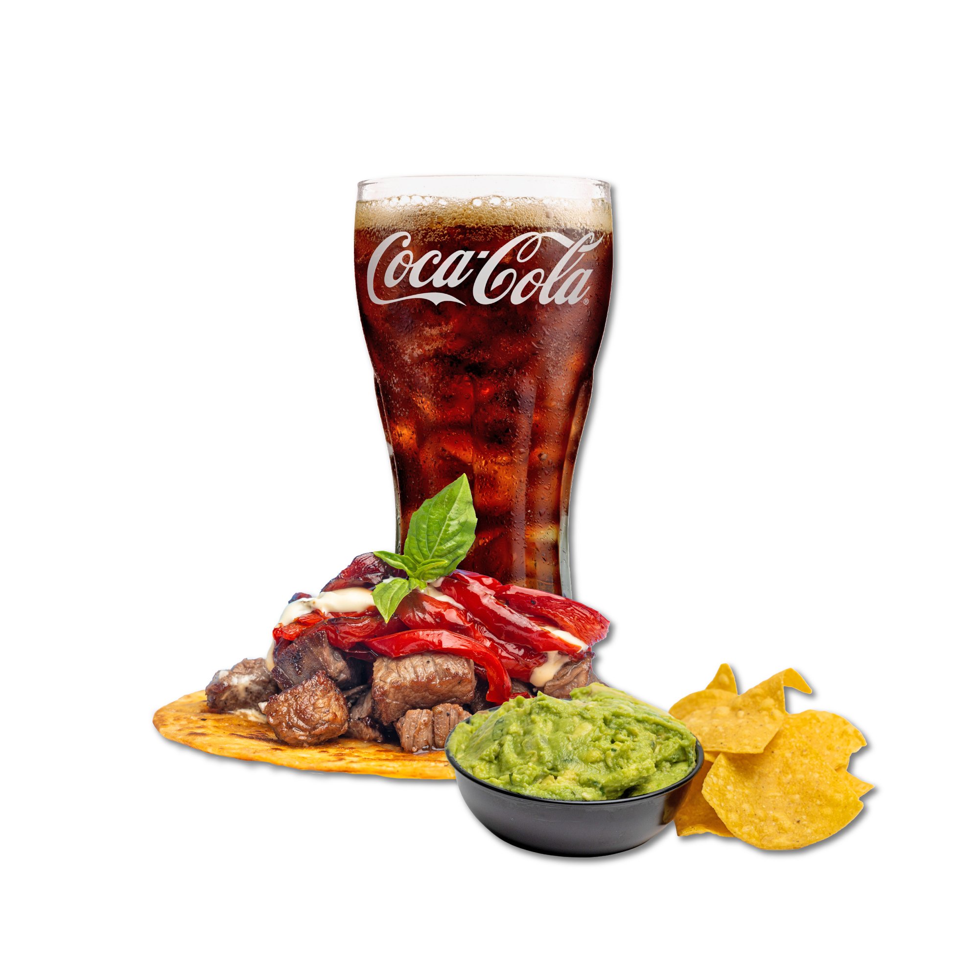 A glass of Coca-Cola with ice, a bowl of guacamole, tortilla chips, and a serving of carne asada with red peppers and a basil leaf on top.