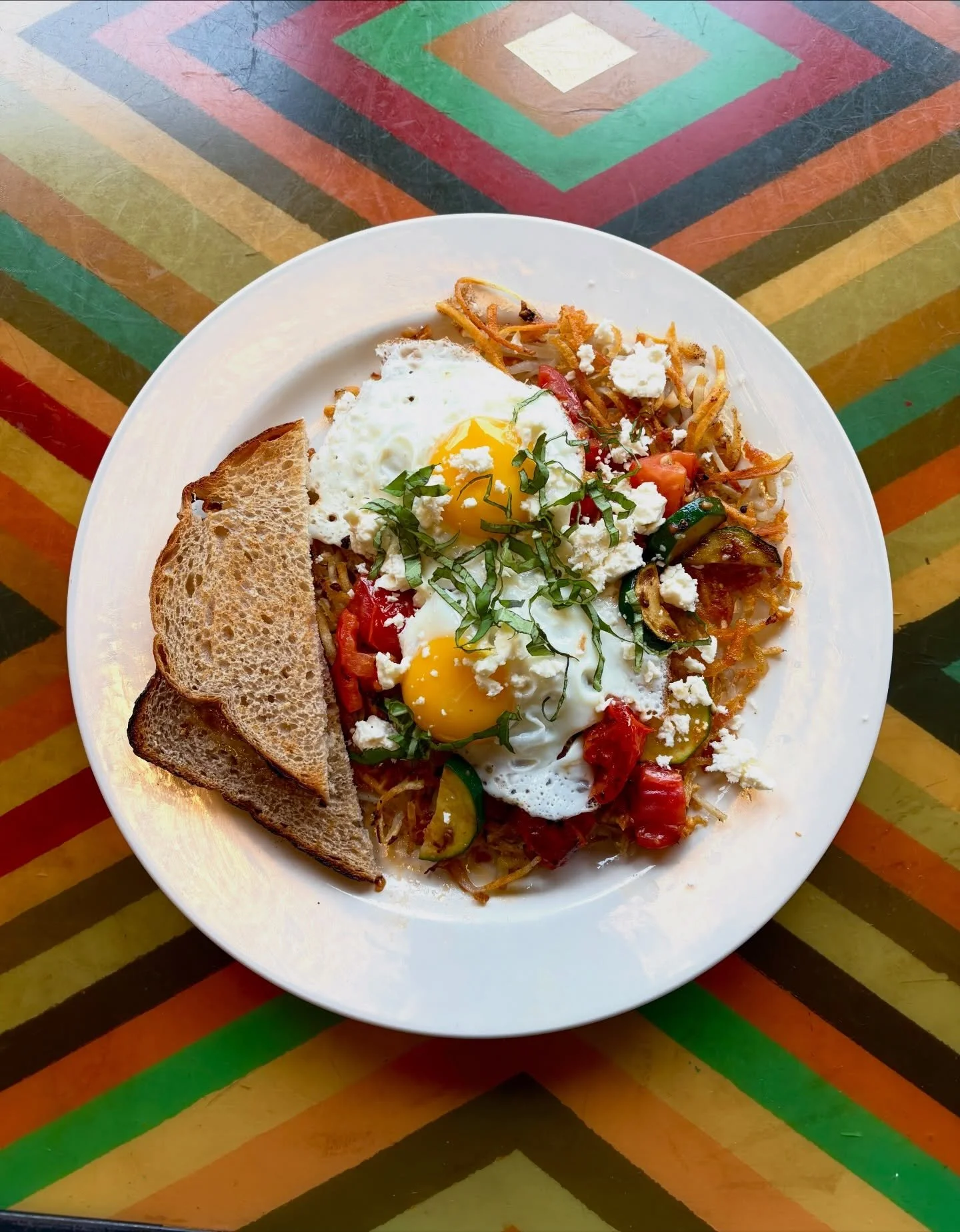 Good morning! 
We have a delicious hashbrown special loaded up with vegetables today!
Full order crispy hashbrown, zucchini, garlic, tomato, basil, two eggs or tofu your way plus feta or tofu spread and toast or tortillas.
🌱
Heads up we are unable t