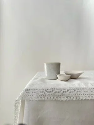 Linen runner with lace edge