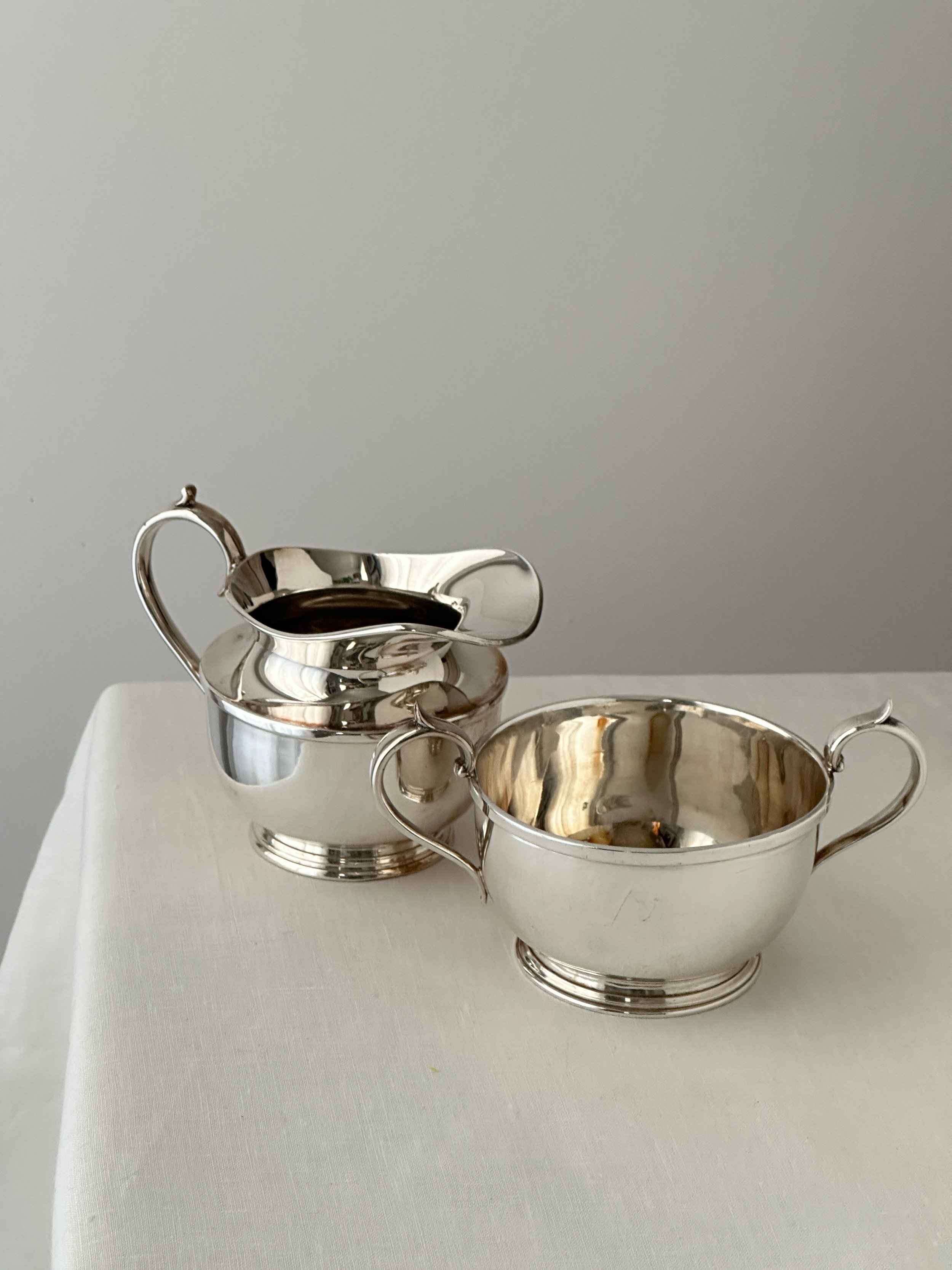 Silver creamer and sugar bowl