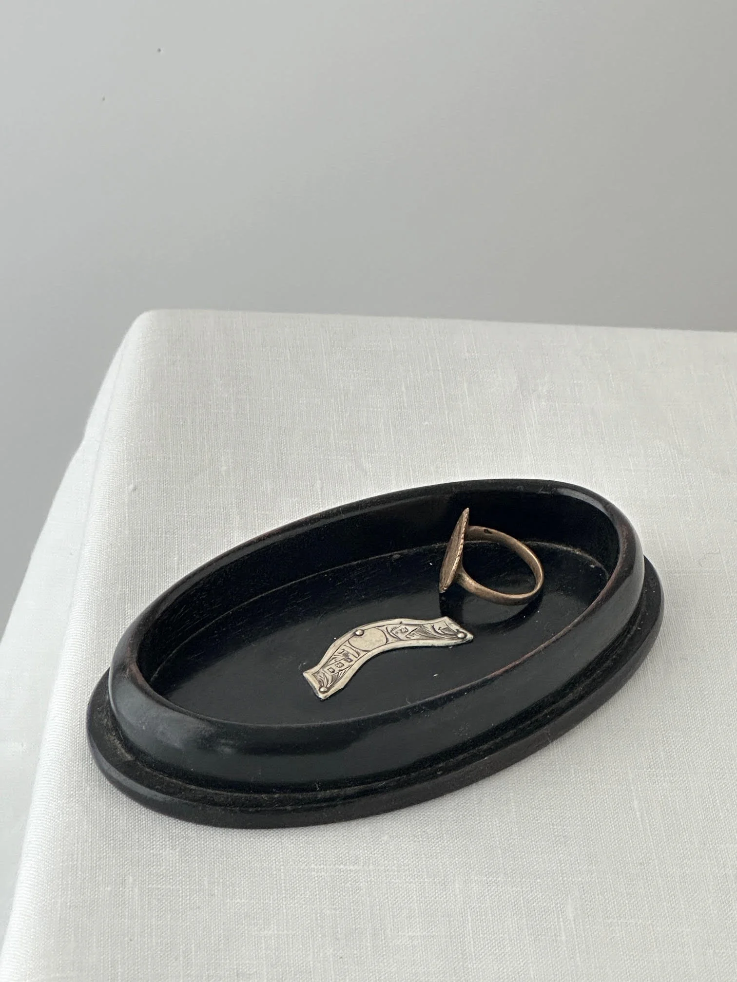 Small Ebony stamped dish with sterling silver decorative motif
