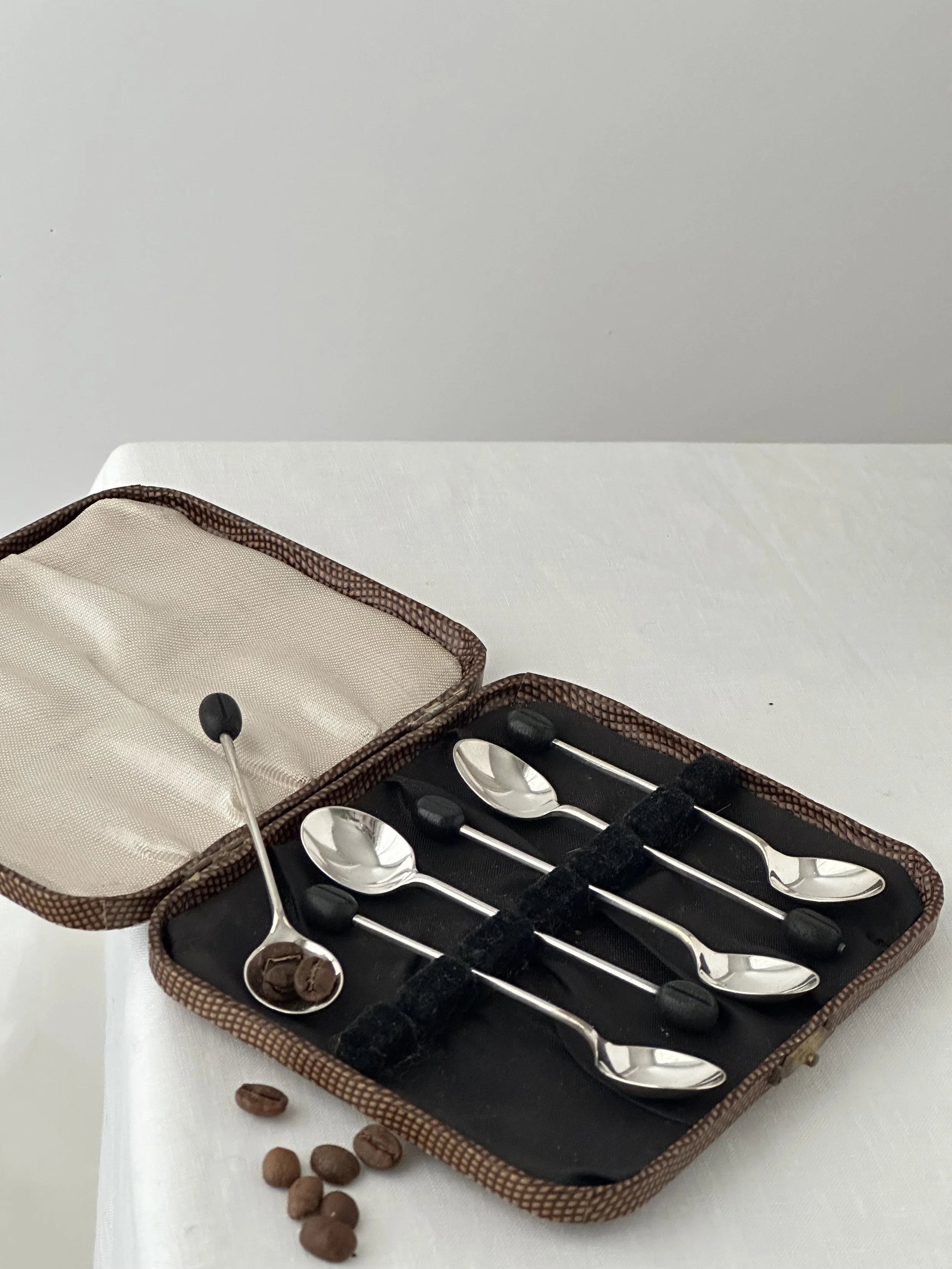 Set of 6 silver plated demitasse spoons with coffee bean design on handle