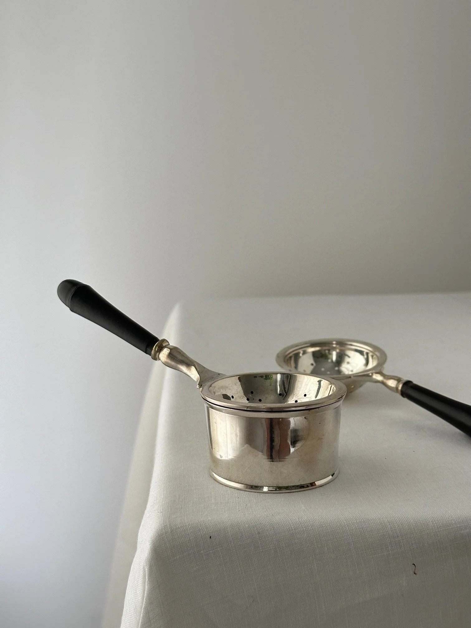 Nickel plated Tea strainer with catch all dish.