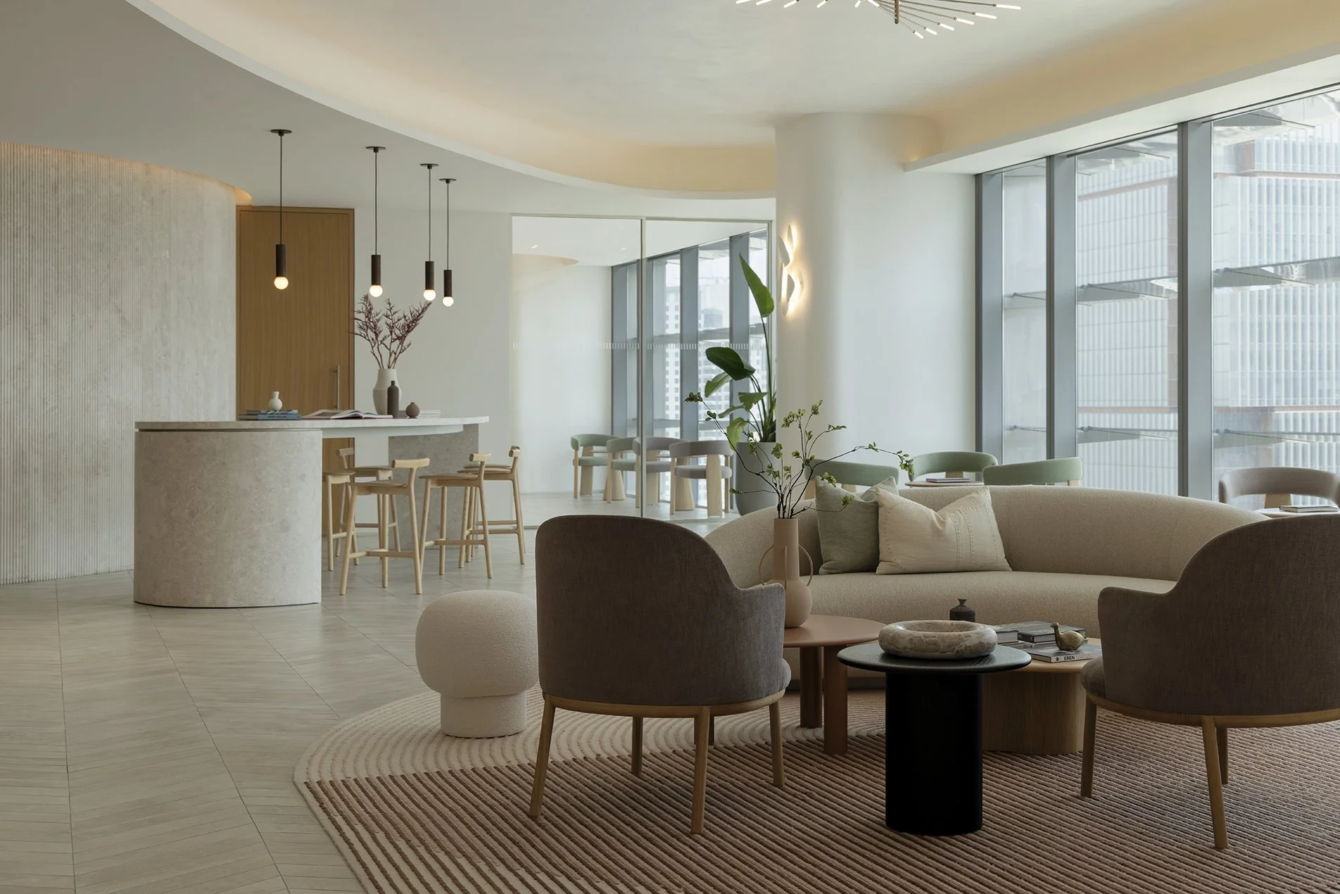 Modern living room with large floor-to-ceiling windows, beige and green furniture, indoor plants, and minimalist decor.