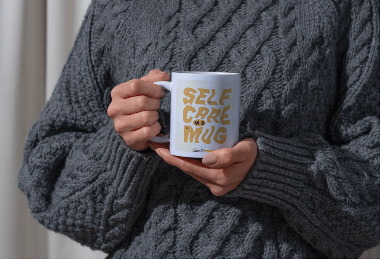 Mug mockup with person.png