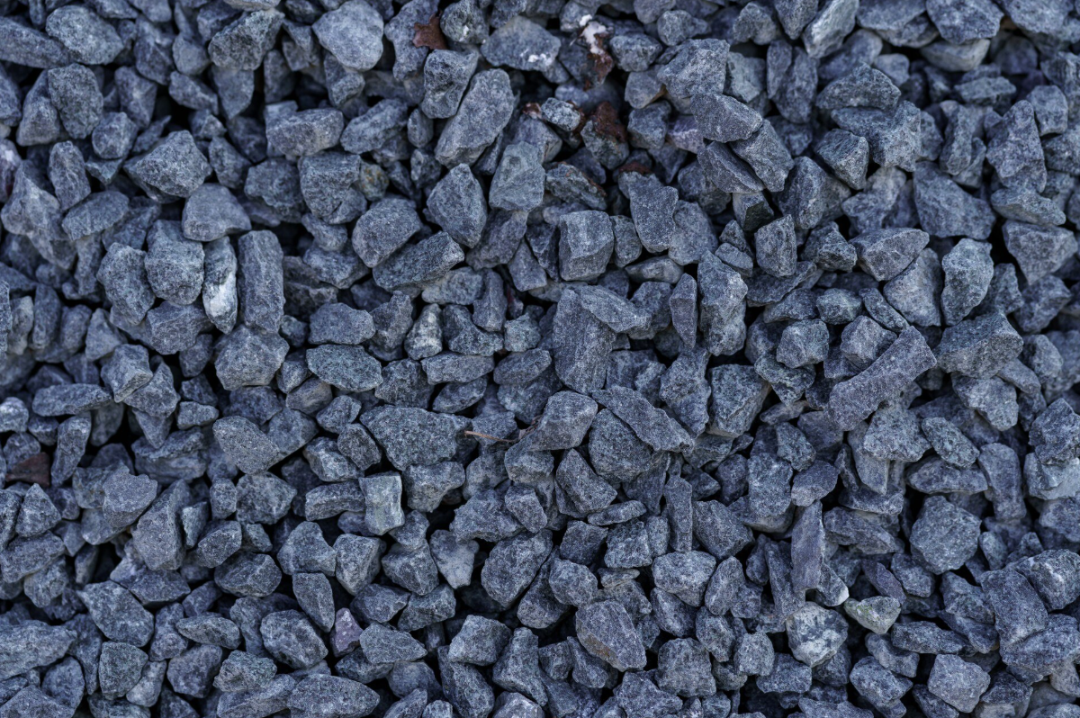 A close-up view of small, jagged gray gravel stones.