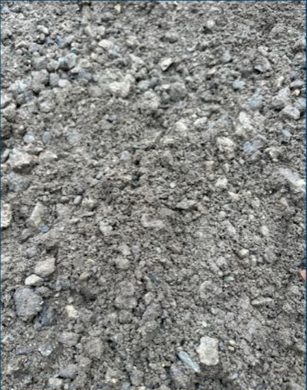 close-up of dirt or soil with small rocks and uneven surface.