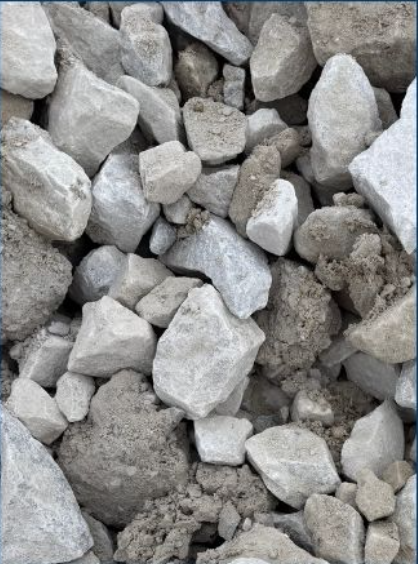 A pile of gray and beige crushed stones and gravel.