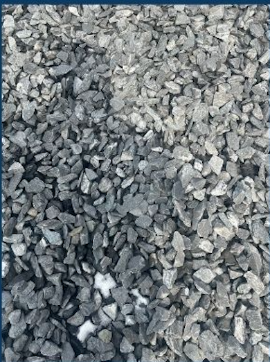 Close-up of gray gravel rocks scattered on the ground.