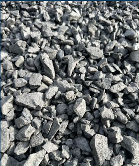 Close-up of gray gravel stones on the ground.
