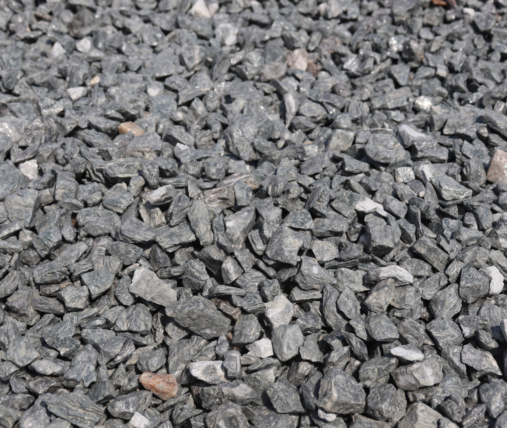 Close-up of small gray gravel stones covering the ground.