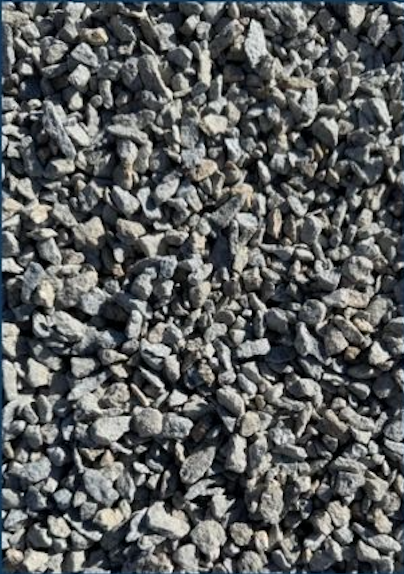 Close-up of small gray and brown gravel stones on the ground.
