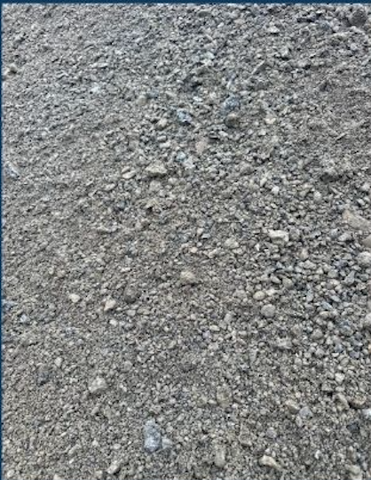 Close-up of a gravel surface with small rocks and dirt.