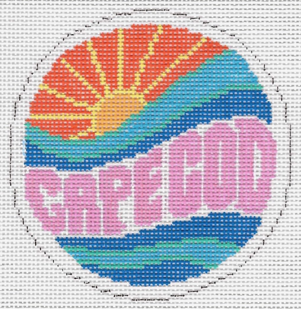 A circular needlepoint design featuring a colorful beach scene with a sunset, ocean waves, and the words Cape Cod in pink