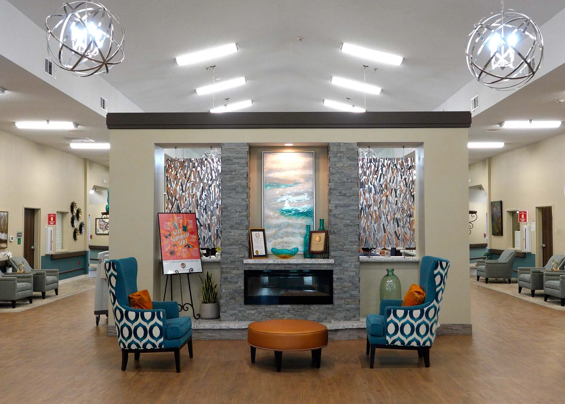 A reception area with modern decor, seating, and artwork.