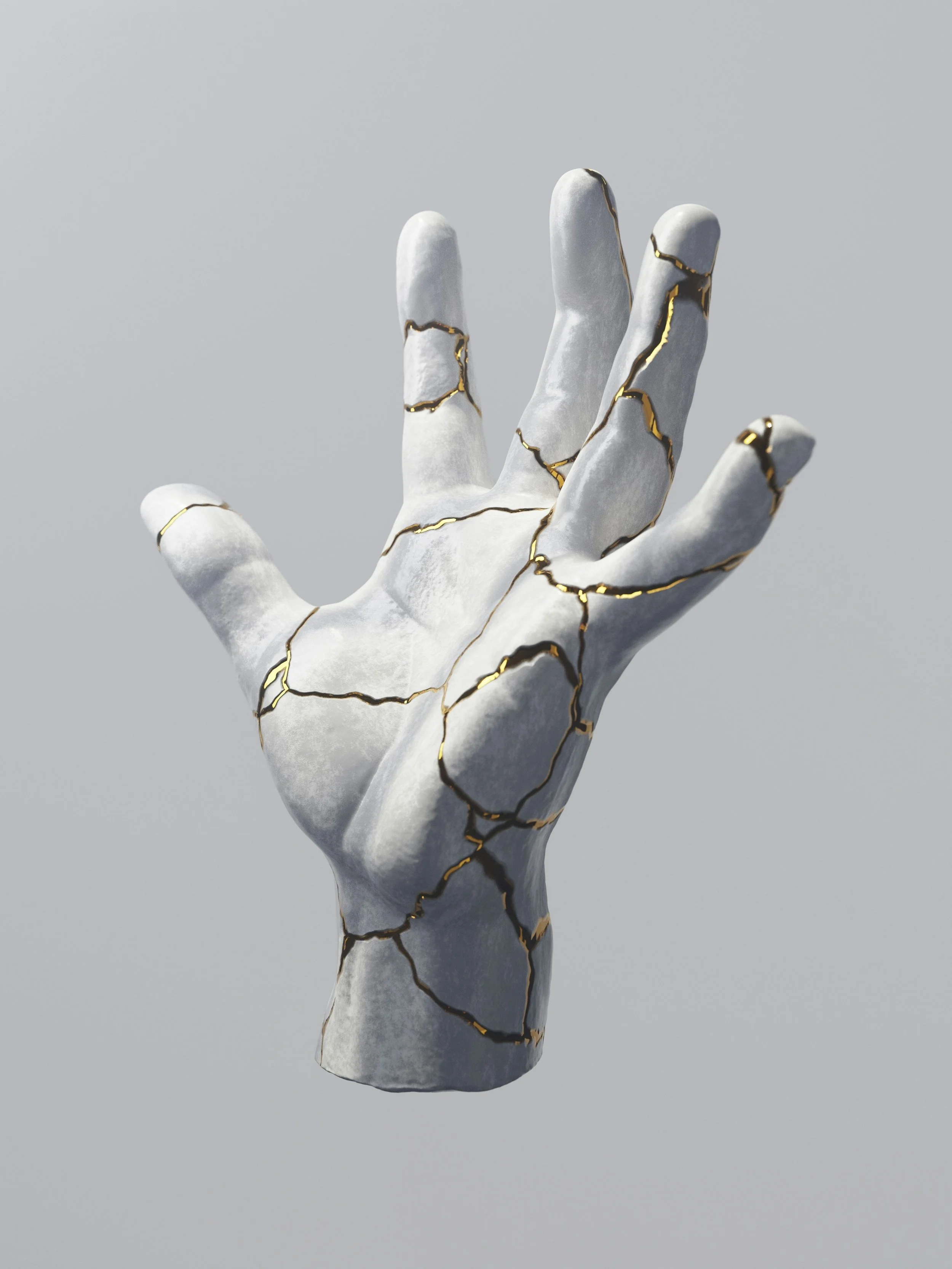 A hand painted to resemble white marble with gold veining, raised against a plain gray background.