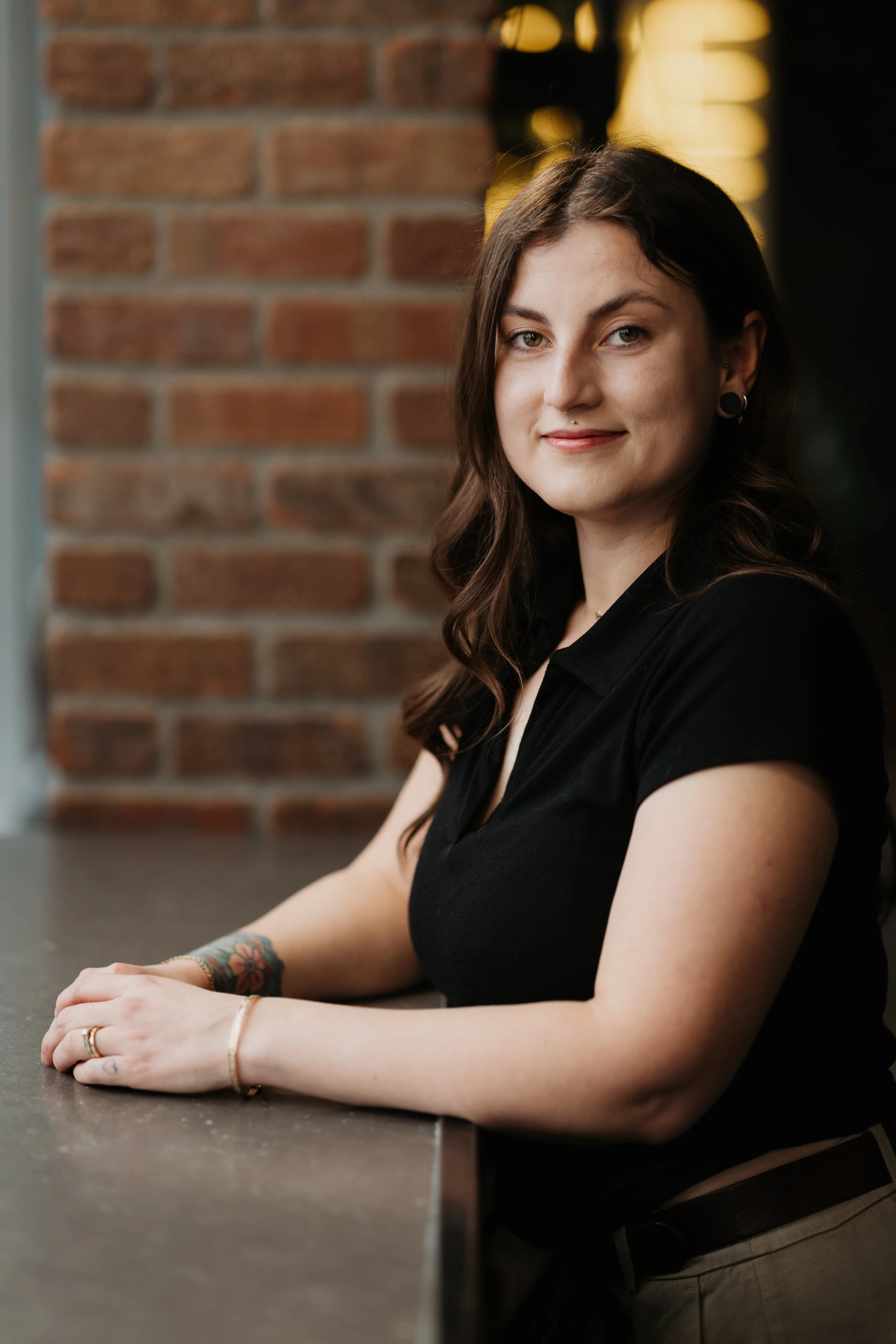 Samantha Stone, therapist in Kelowna, sitting comfortably and smiling.