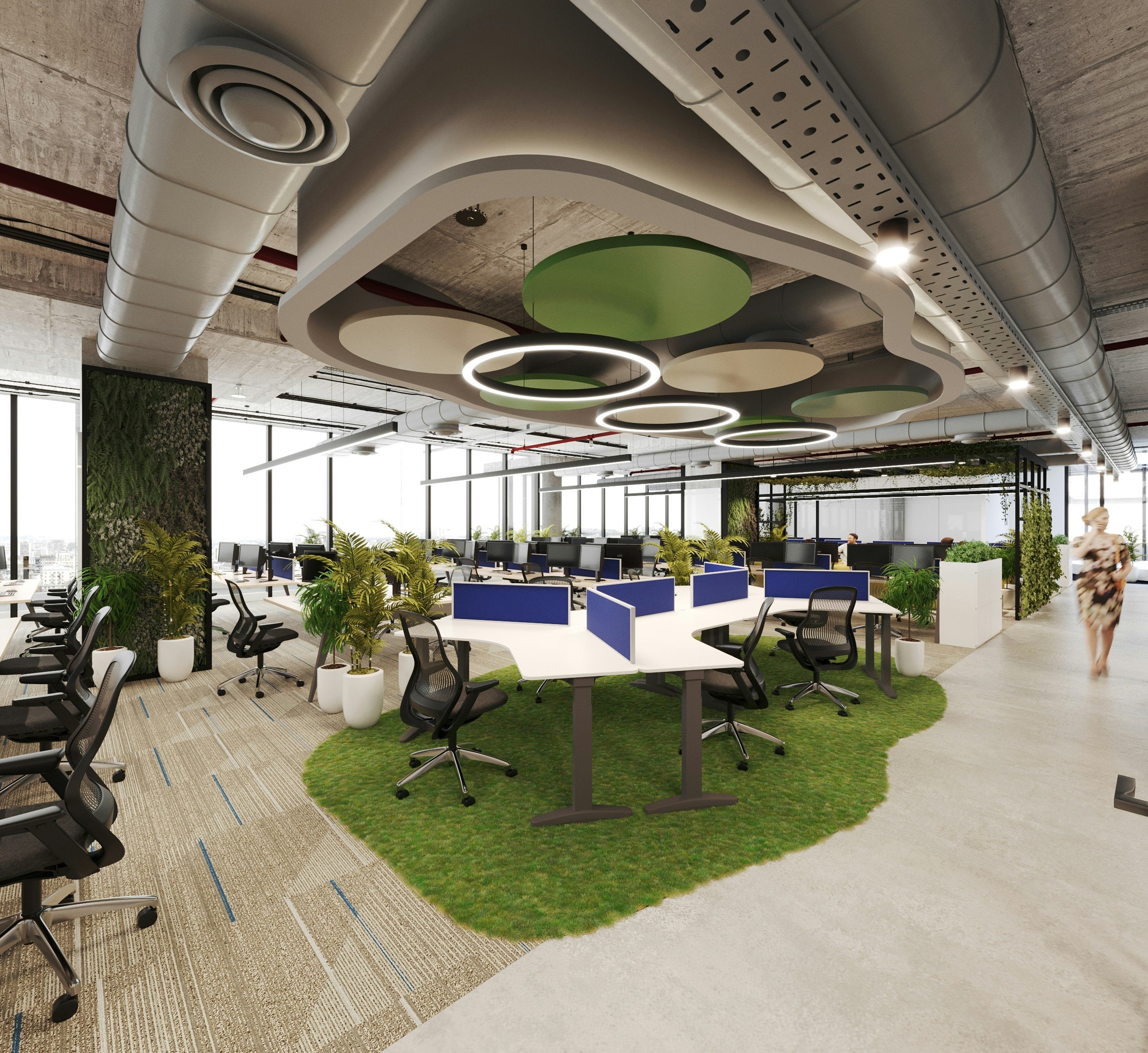 Modern open office space with multiple desks, ergonomic chairs, and indoor plants, featuring a green circular rug and artistic ceiling design with circular fixtures.