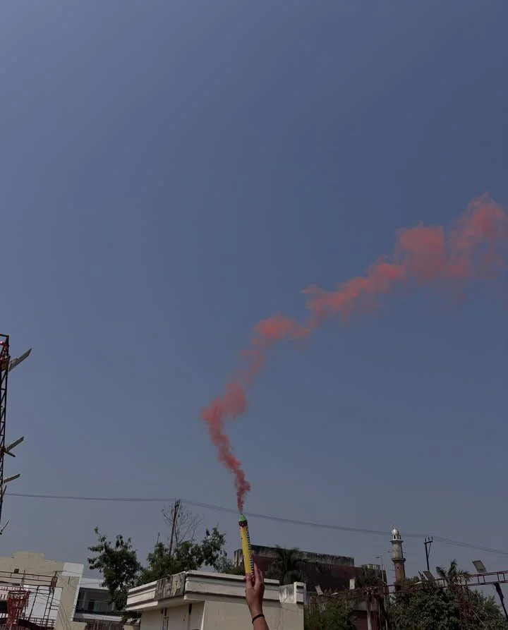 The ancient art of smoke signal communication used in a modern fashion against a clear blue sky.