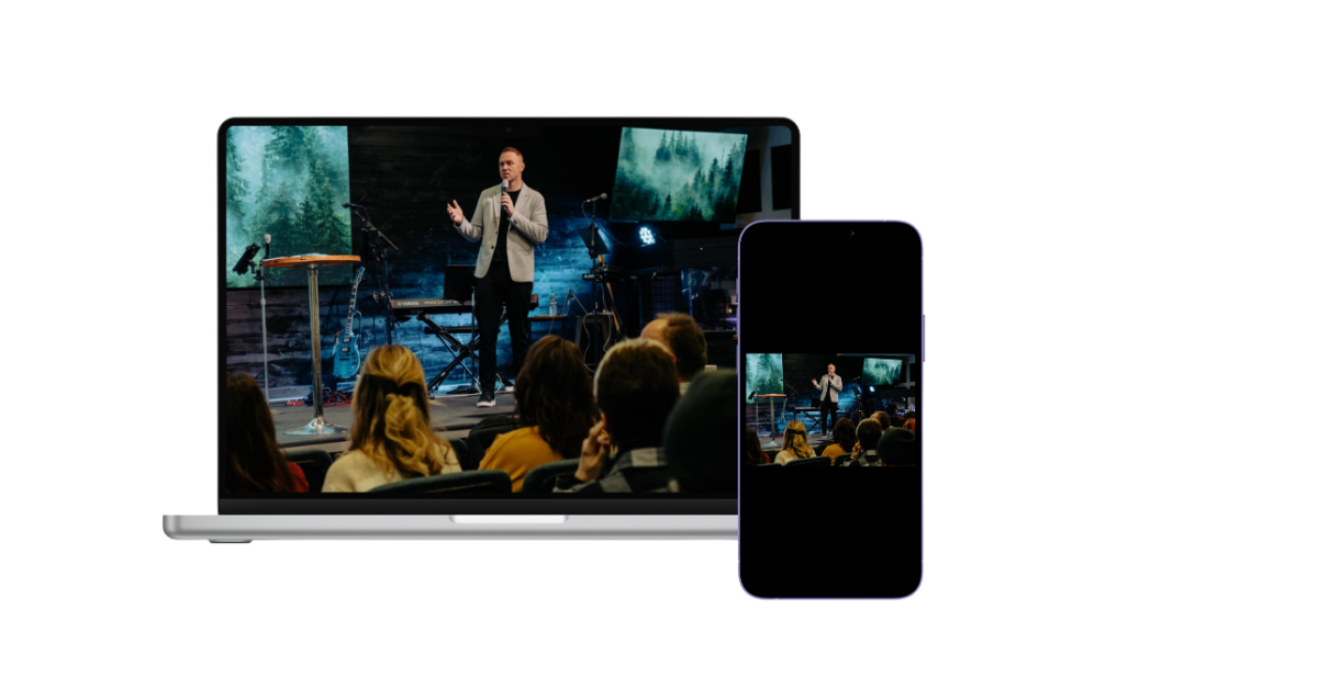 Laptop and smartphone displaying a man giving a presentation to an audience with a forest landscape backdrop.