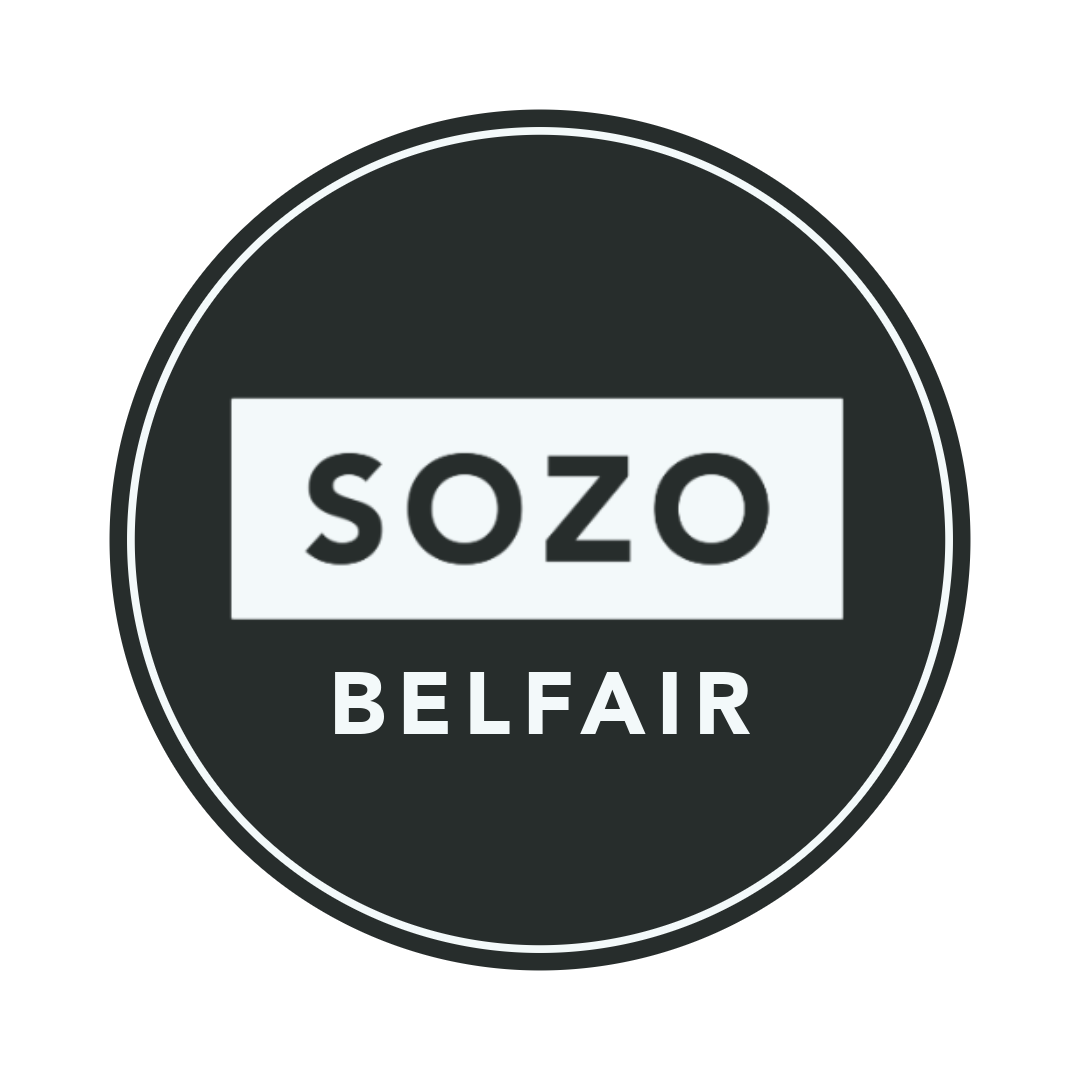 Logo for Sozo Belfair, featuring a round black background with white text reading "sozo" in a white rectangle and "BELFAIR" below.