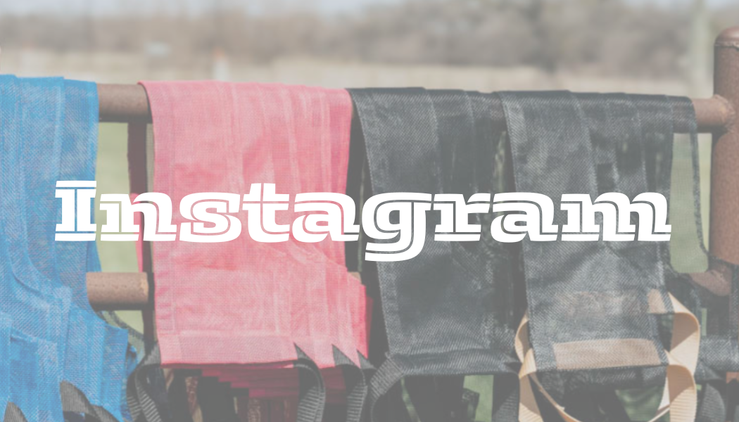 Colorful hammocks hanging on a metal fence outdoors with the word 'Instagram' overlaid.