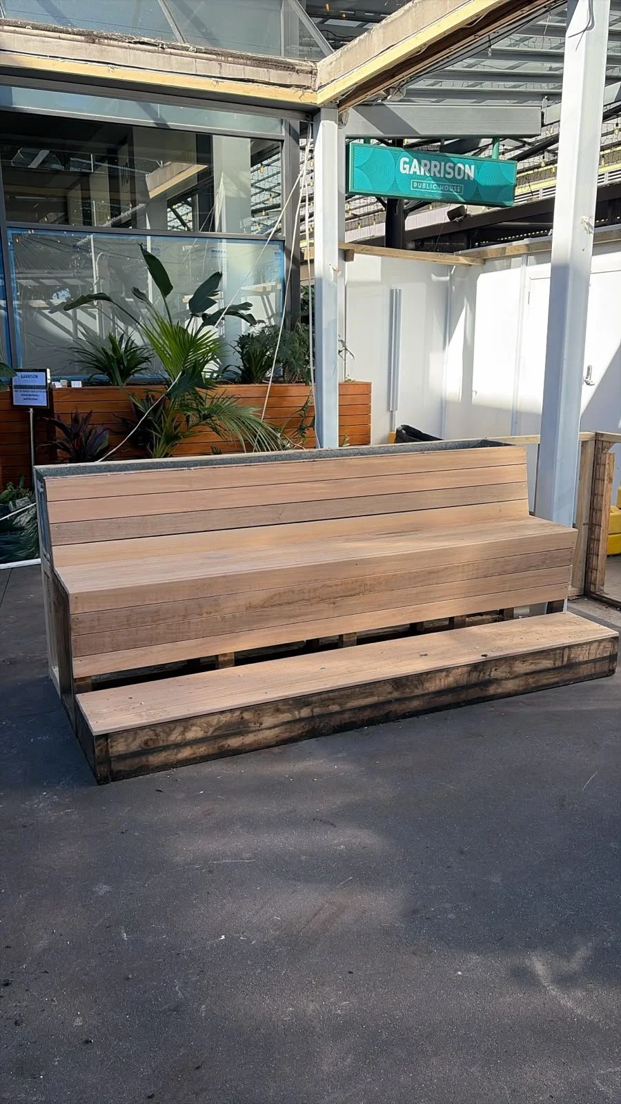 Custom timber bench seating fabricated by Form & Finish for the outdoor area of Sports & Rec Bar.