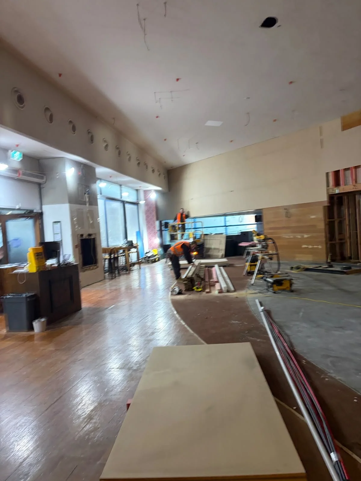 Form & Finish crew working on interior framing and timber wall lining at Sports & Rec Bar.