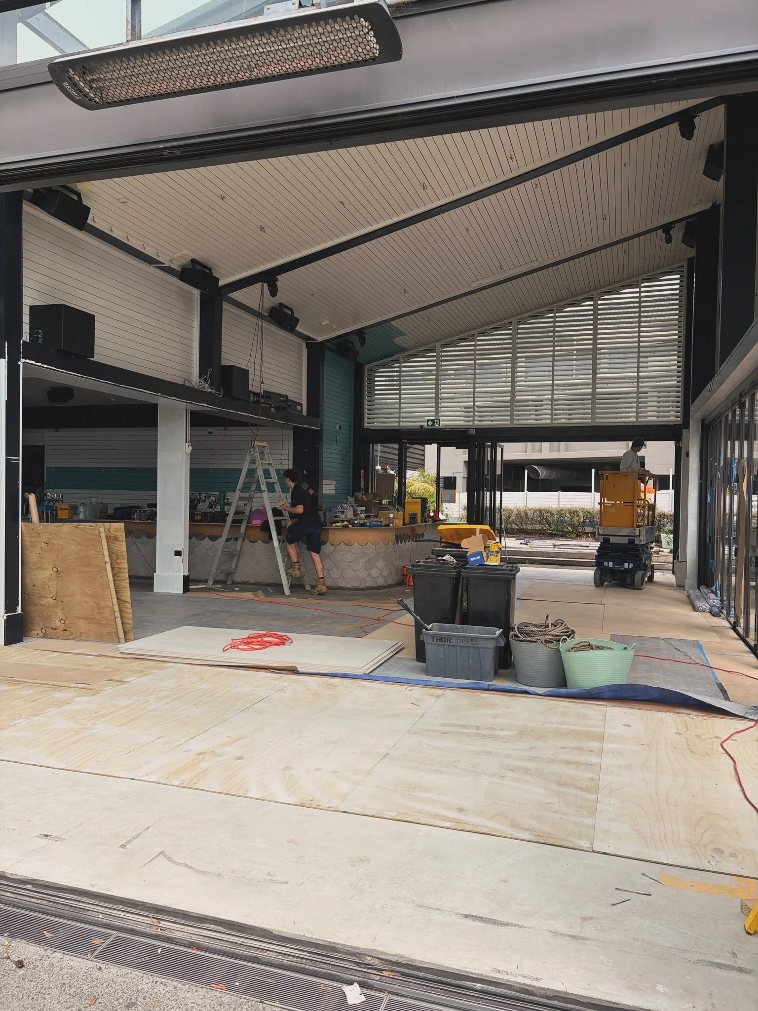 Interior fit-out underway at Regatta Bar, Takapuna, with ceiling panelling and bar joinery in progress.
