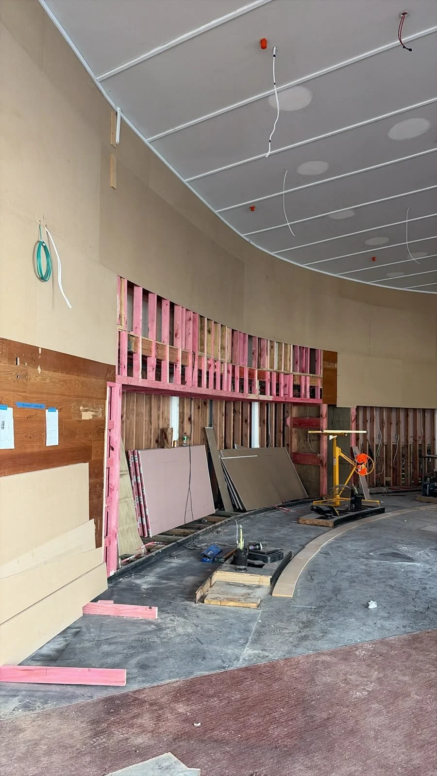 Interior framing and curved ceiling structure underway at Sports & Rec Bar.
