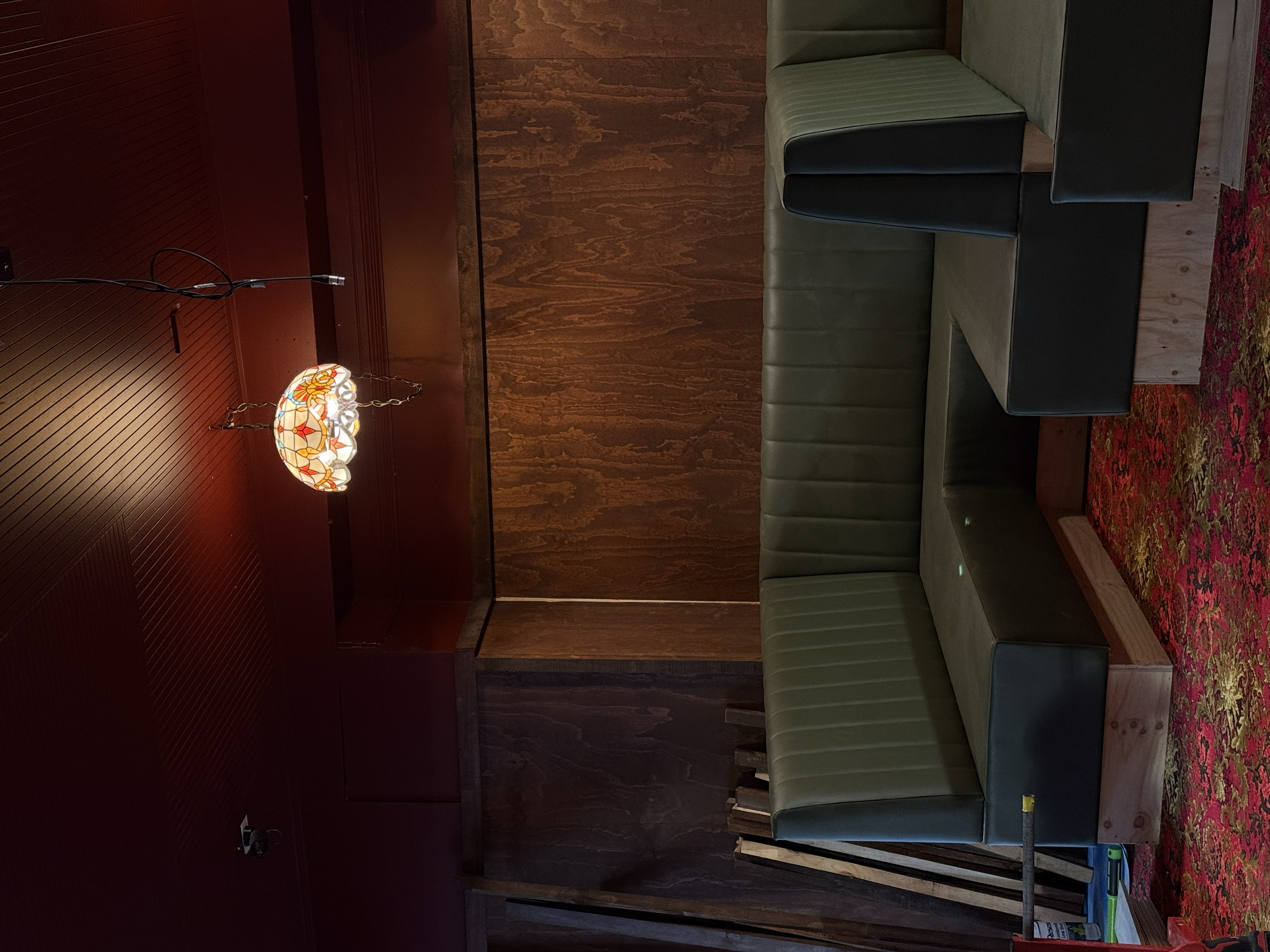 Custom booth seating and timber wall panelling nearing completion during the fit-out of Goldies Bar, Takapuna.