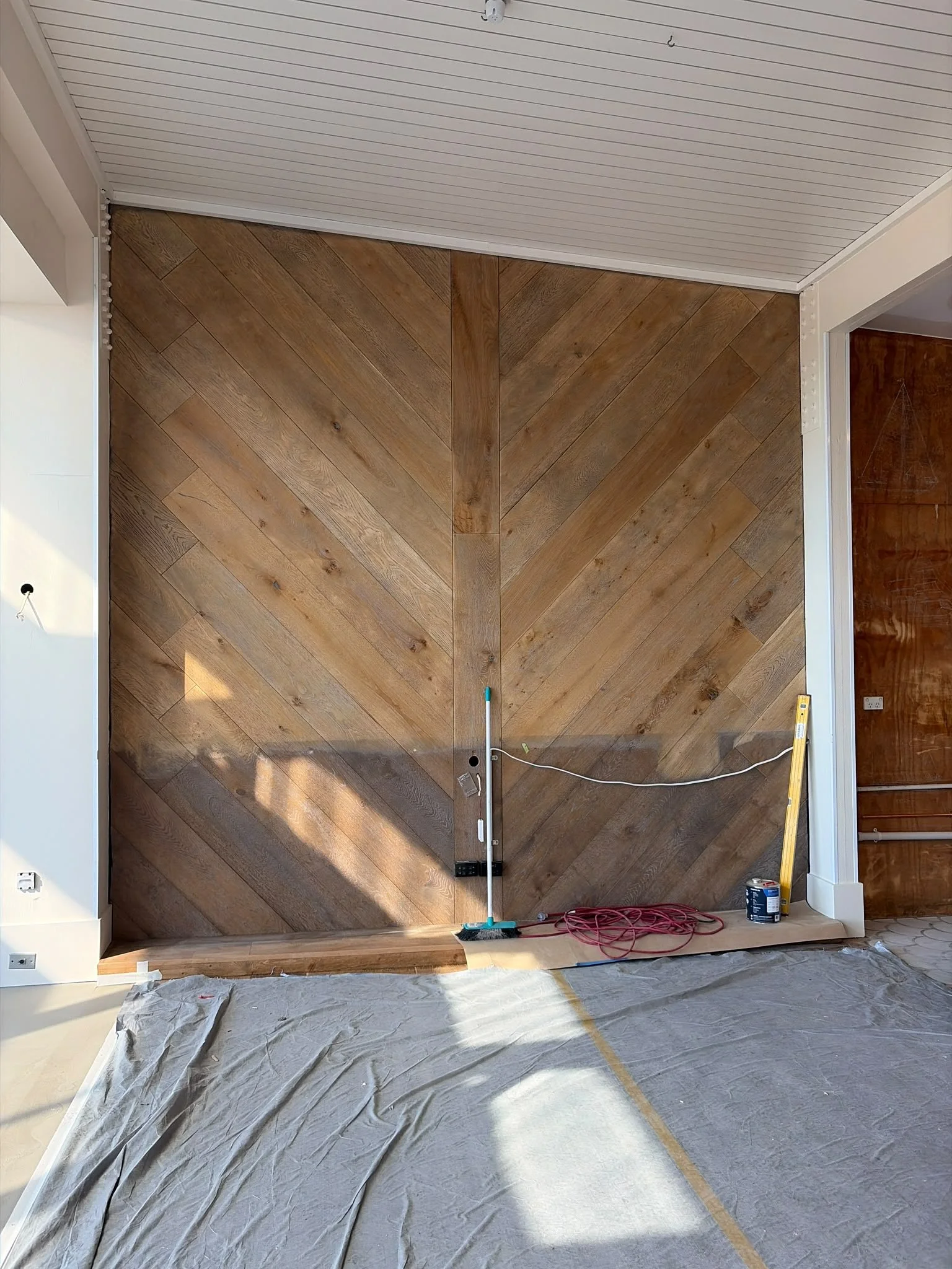 Herringbone timber feature wall installed by Form & Finish during the fit-out of Regatta Bar, Takapuna.