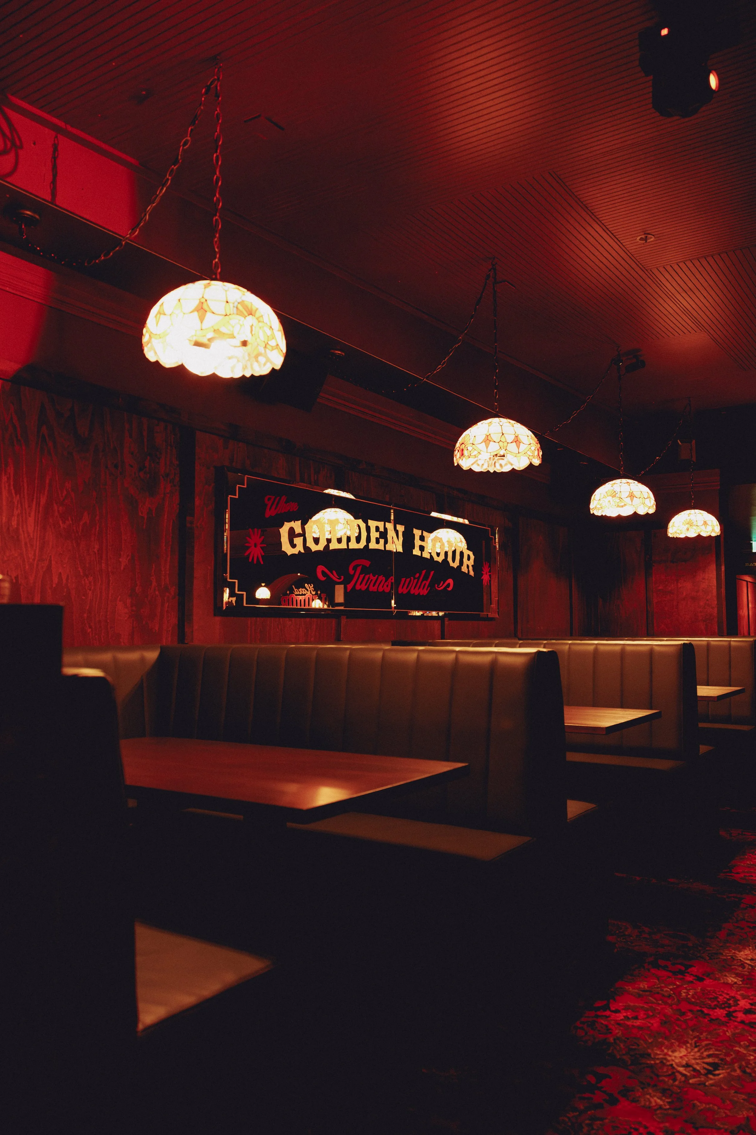 Interior of Goldies Bar, Takapuna, featuring custom booth seating, timber ceiling panelling and wall lining by Form & Finish.