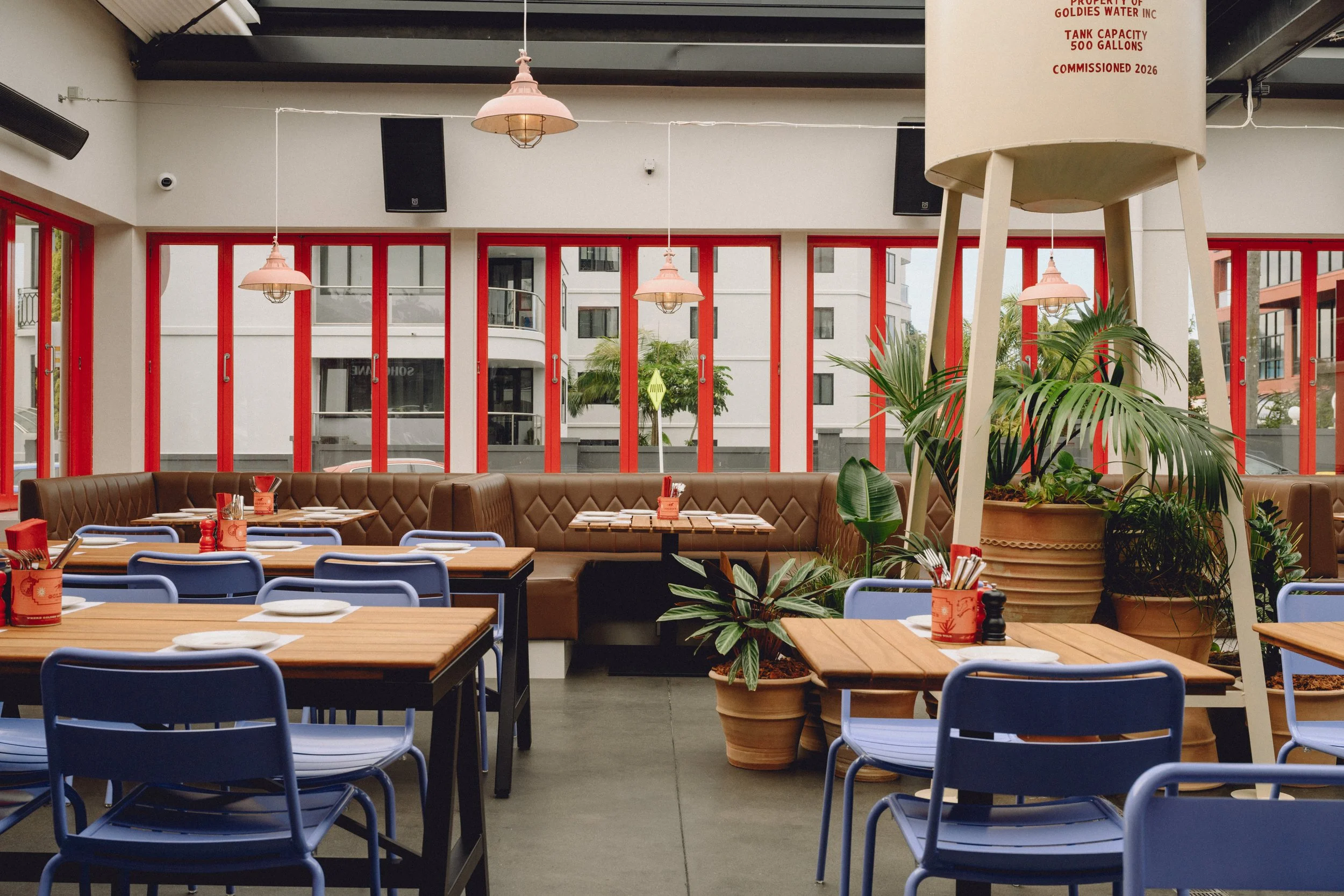 Dining area of Goldies Restaurant, Takapuna, featuring custom leather booth seating and timber joinery by Form & Finish.