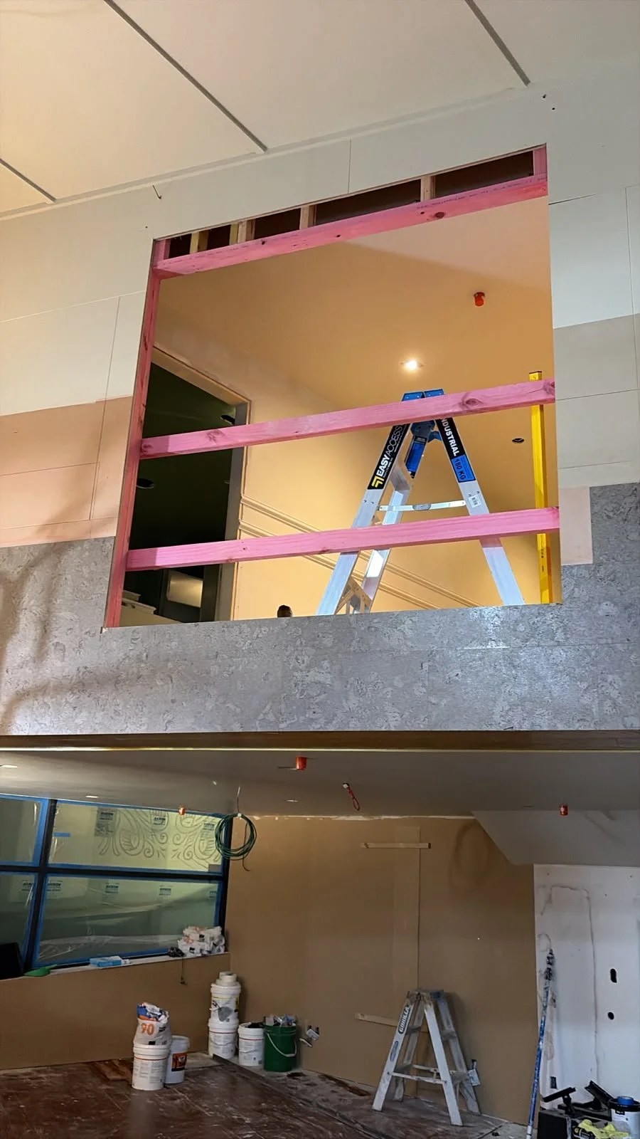 Internal framing and ceiling works in progress across two levels at Sports & Rec Bar.