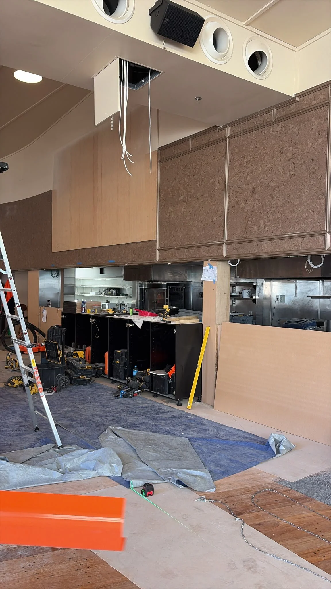 Cork wall tiling and custom cabinetry taking shape at Sports & Rec Bar.