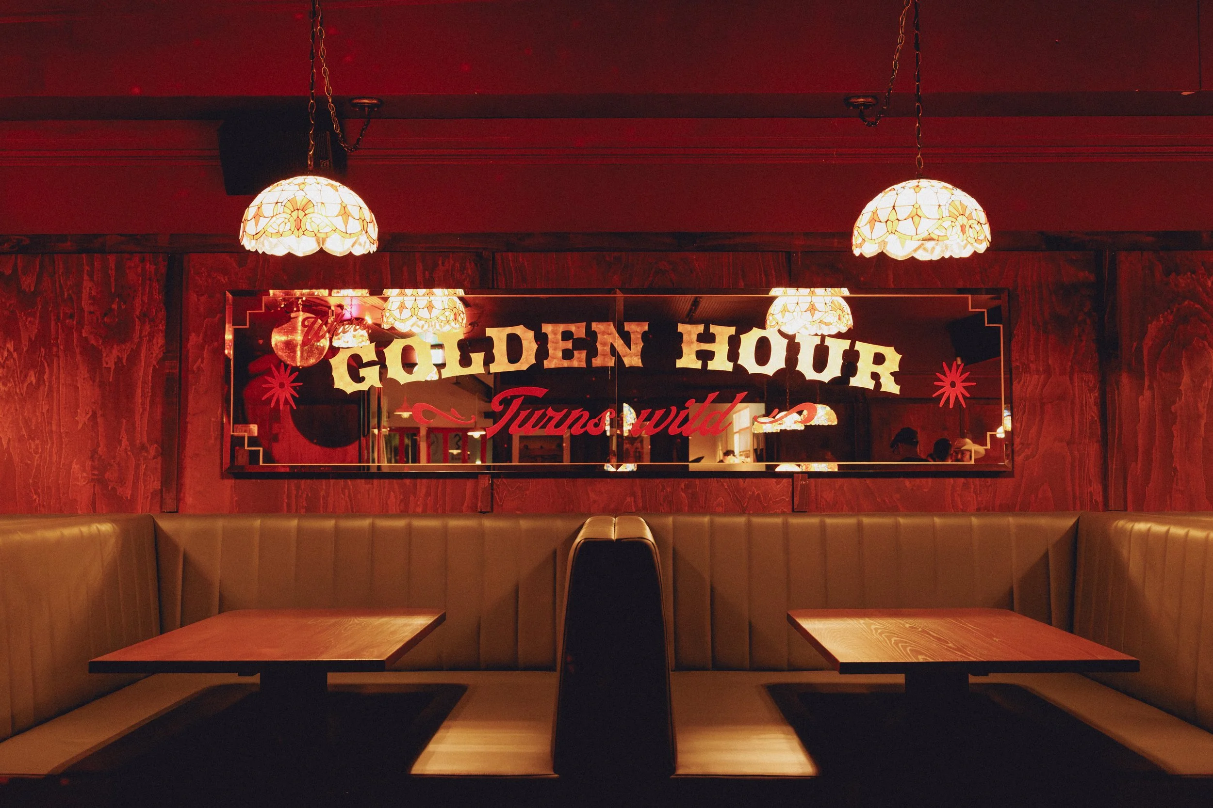 Interior of Goldies Bar, Takapuna, featuring custom booth seating and timber wall panelling by Form & Finish.