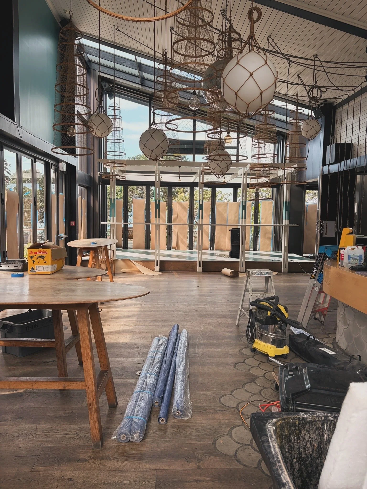 Interior fit-out nearing completion at Regatta Bar, Takapuna, with timber flooring, ceiling panelling and custom joinery by Form & Finish.