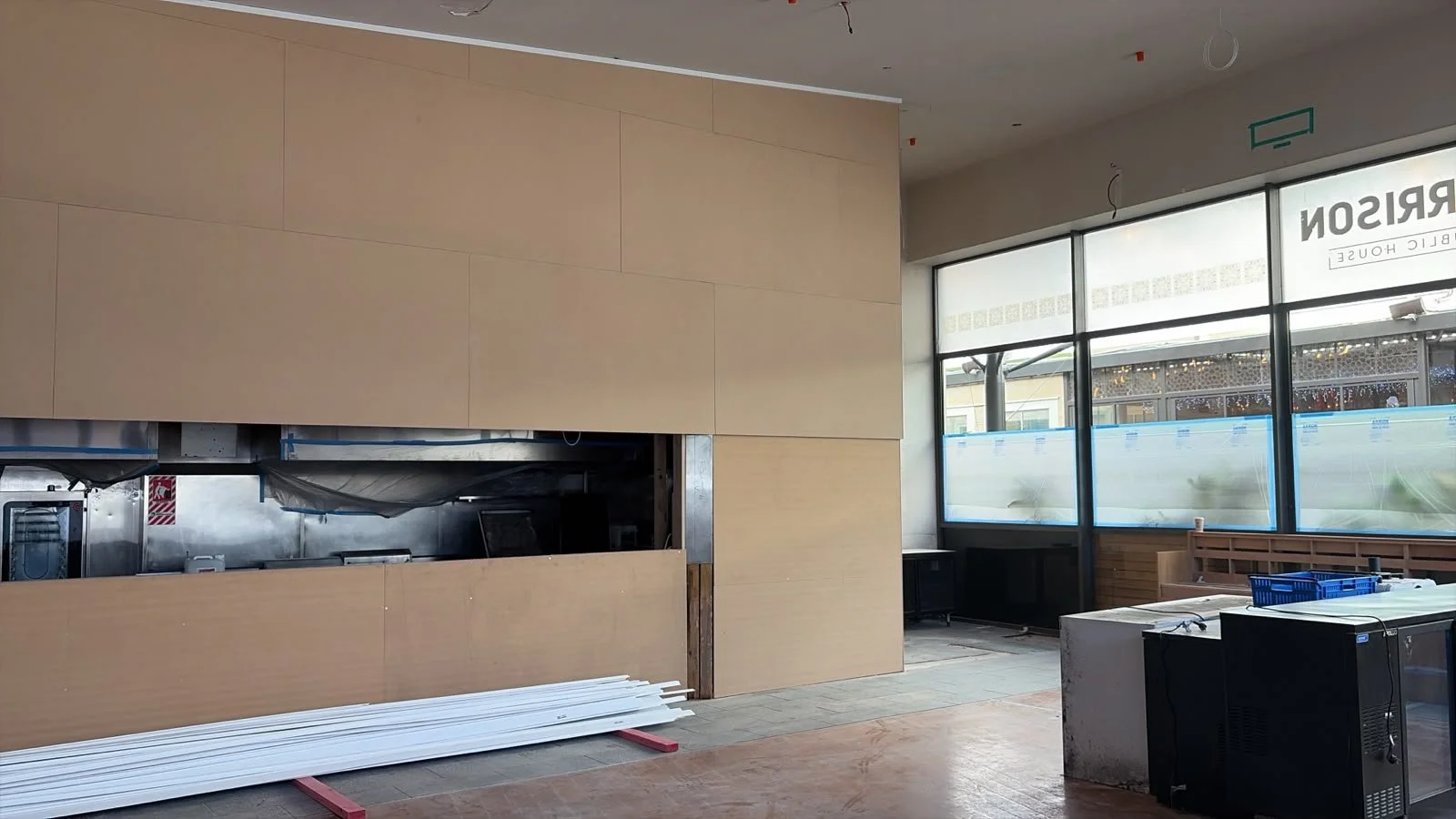 Timber wall panelling and kitchen servery joinery being fitted at Sports & Rec Bar.