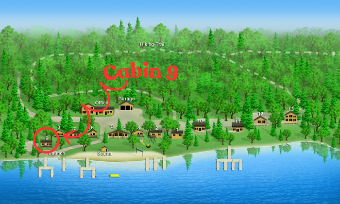 Map of a lakeside cabin area showing numbered cabins, a launch, sauna, office, garage, and hiking trail through a forest, with docks on the lake.