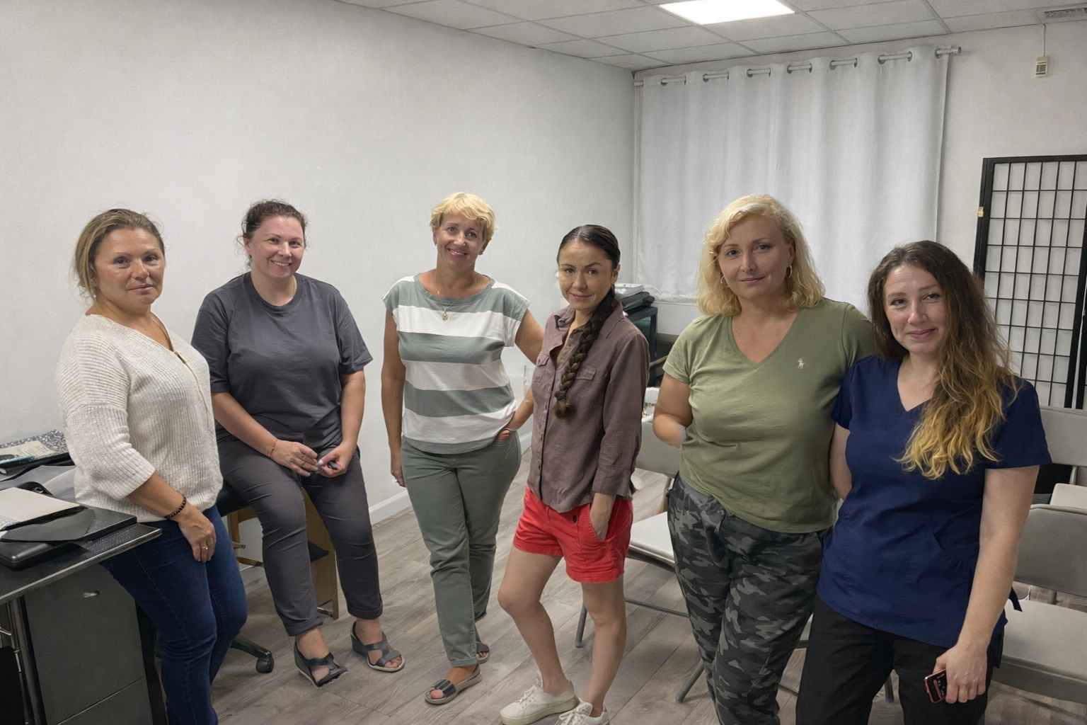 Group of women in an office setting.png